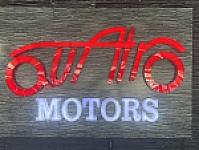 quatro motors showroom logo
