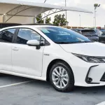 TOYOTA COROLLA GLI HYBRID 1.8L 2024 MODEL YEAR WHITE COLOR EXTERIOR - Thumbnail 1