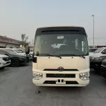 2024 Toyota Coaster 4.0L Diesel 23 seater 2024 with cool box, luggage rack, and curtains - Thumbnail 1
