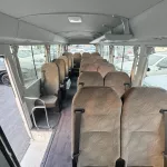 2024 Toyota Coaster 4.0L Diesel 23 seater 2024 with cool box, luggage rack, and curtains - Thumbnail 9