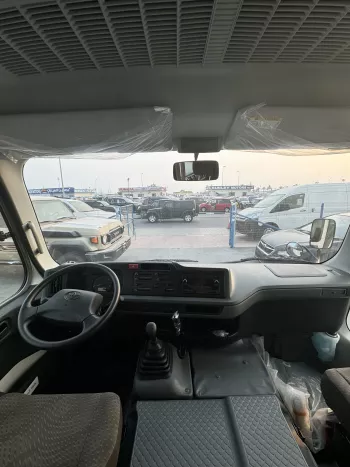 2024 Toyota Coaster 4.0L Diesel 23 seater 2024 with cool box, luggage rack, and curtains
