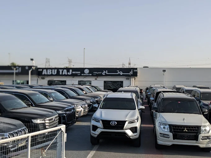 ABU TAJ FZCO dealership logo